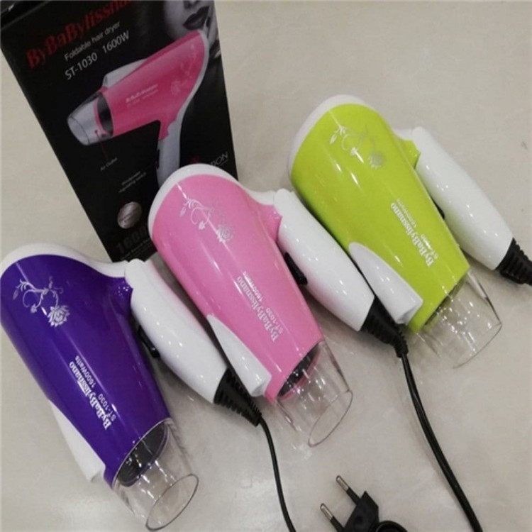 سشوار مسافرتی مدل st-1030 با توان 1600 وات، موتور AC، تنظیم دما یک حالته، تنظیم سرعت دو سرعته، صافکنندگی و حجمدهندگی، وزن 328 گرم، کاربرد خانگی
