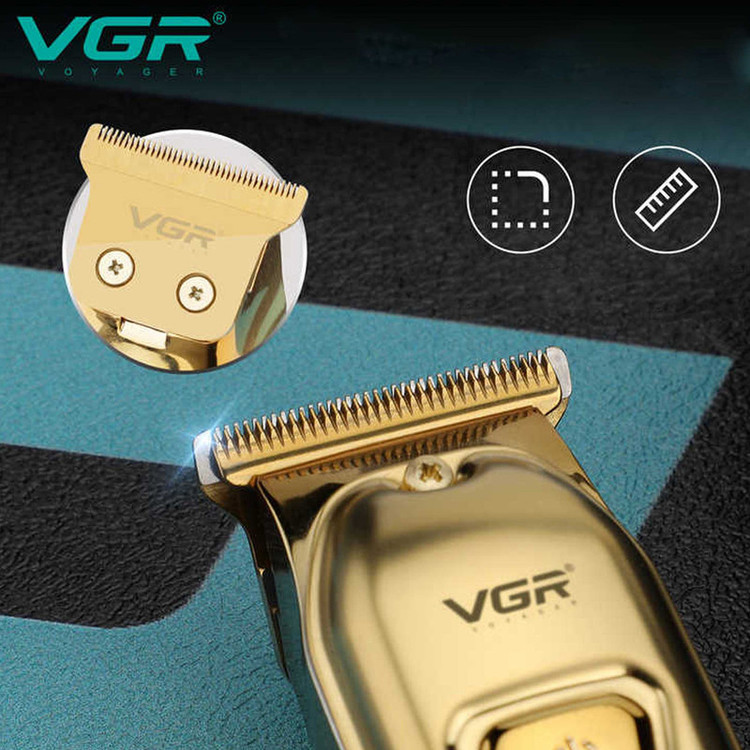 ماشین اصلاح موی سر و صورت وی جی آر مدل V-965 با تیغه استیل ضد زنگ، قابلیت اصلاح با شماره صفر، تنظیم سرعت، شانه قابل تنظیم و باتری 600 میلیآمپر ساعت با شارژ USB و طراحی ارگونومیک و مقاوم در برابر لغزش