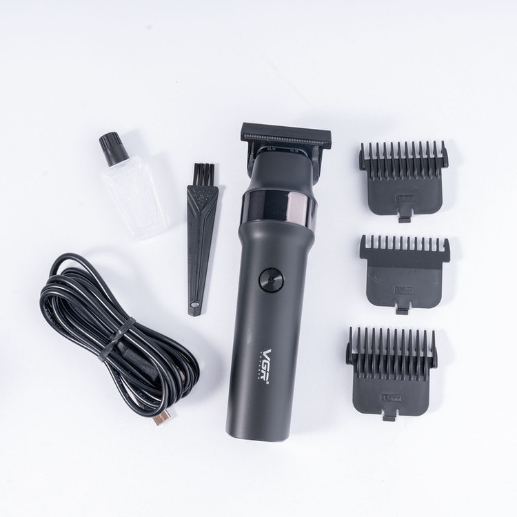 ماشین اصلاح موی سر و صورت وی جی آر مدل V-987 با تیغه سرامیکی و استیل ضد زنگ، موتور دی سی 7000 دور در دقیقه، عملکرد توربو، باتری 2000 میلیآمپرساعتی با 400 دقیقه استفاده و صفحه نمایش الایدی میزان شارژ