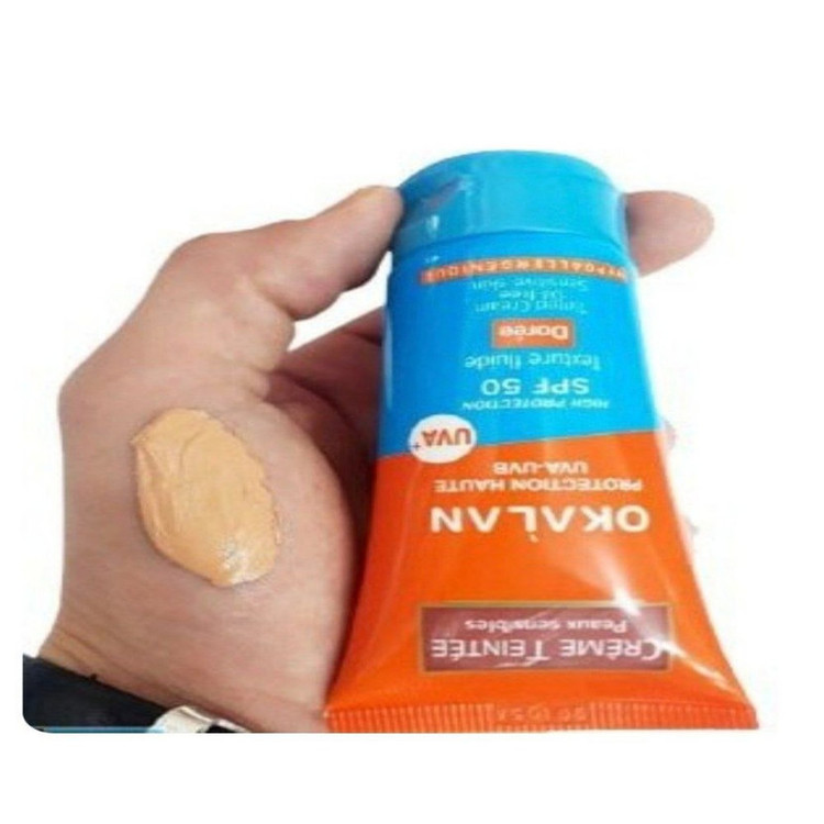 کرم ضد آفتاب رنگی صورت اوکالان SPF 50 مدل Dorée محافظ در برابر اشعه UVA و UVB مناسب برای پوست حساس حجم 50 میلیلیتر